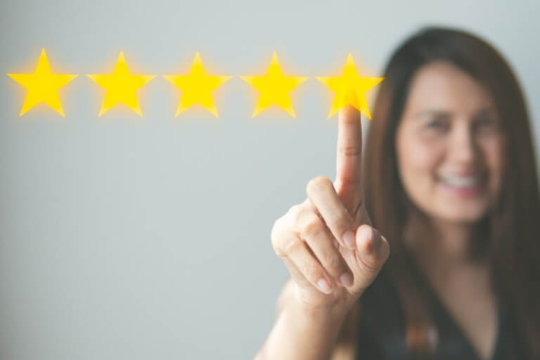 Woman Clicking a 5 Star Rating