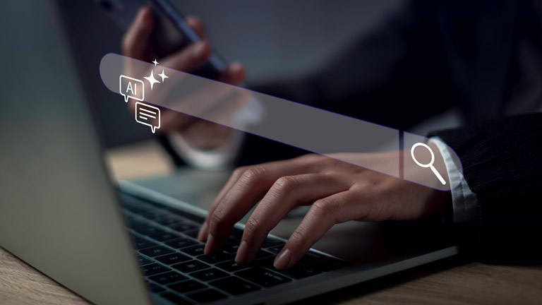 An unseen man in front of a laptop with an ai search bar overlaid on the image.