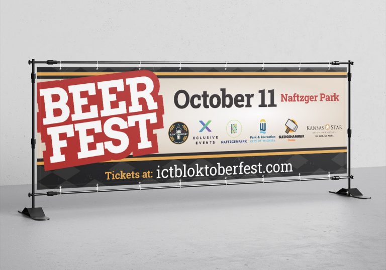 Horizontal standing banner with Bloktoberfest logo and line art graphics.