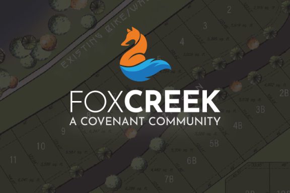 Fox Creek - A Covenant Community logo over a faded plat map.