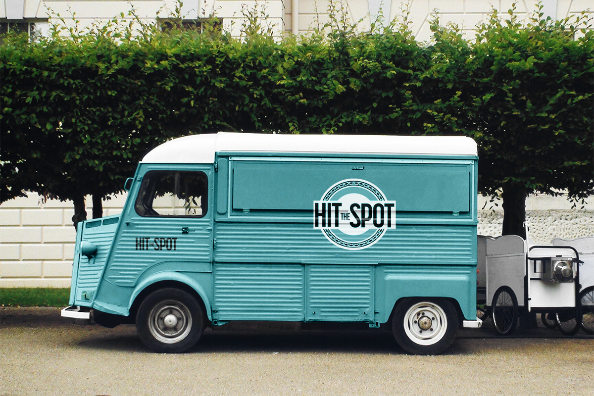 Teal truck with Hit the Spot logo