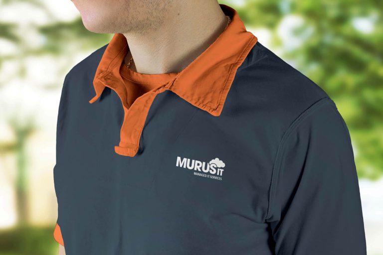 A navy blue and orange polo shirt with the Murus It logo on it in white.