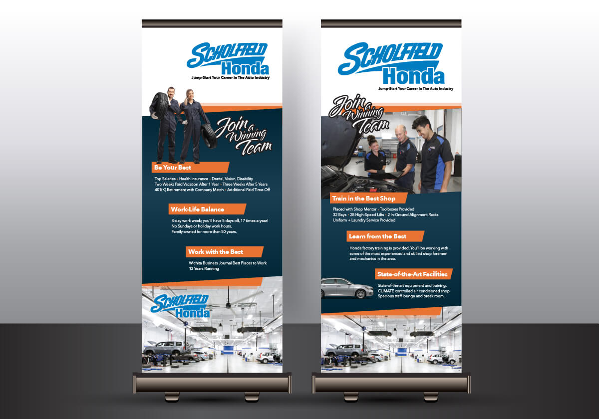 Two retractable banners advertising mechanic positions at Scholfield Honda.
