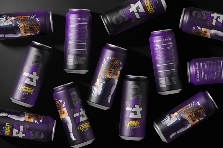 Purple and black Avery Johnson Strawberry Lemonade cans. They are scattered randomly on their sides.